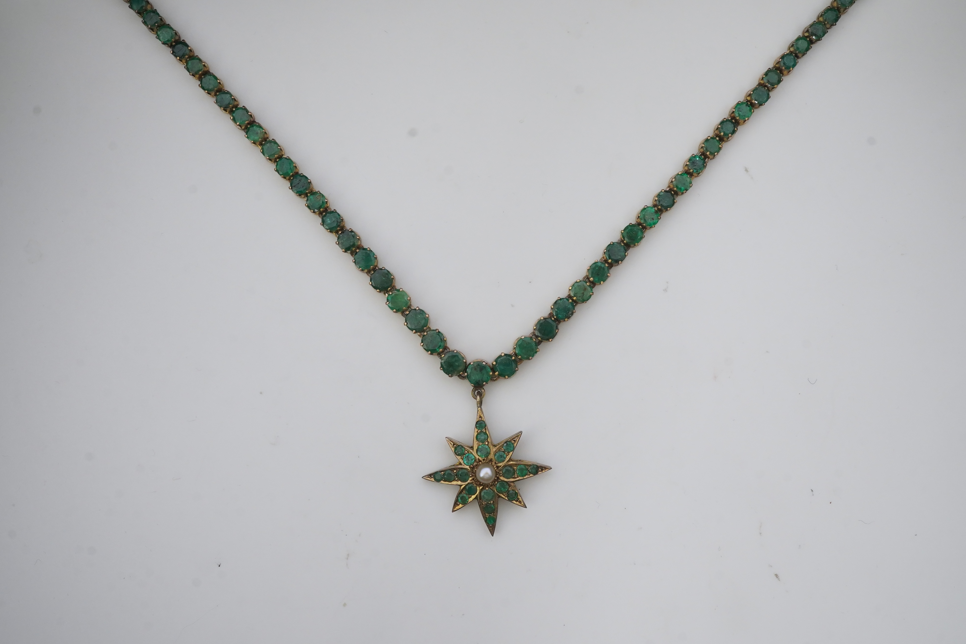 An emerald and pearl necklace